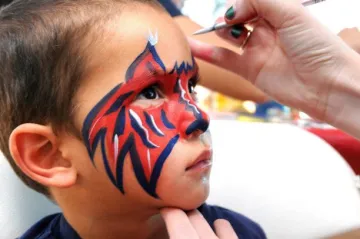 Child getting face painted